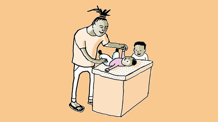 Un padre che cambia il pannolino al proprio figlio - Immagine illustrativa relativa al congedo parentale